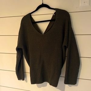 Cropped sweater with knot detail in back slightly off shoulder